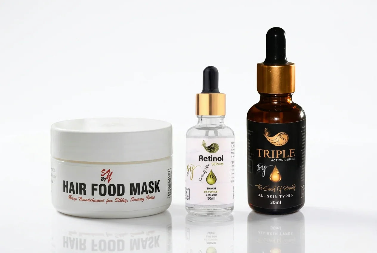 Hair food mask tub, retinol serum, and triple action serum in glass bottles on white background